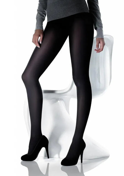 Person wearing black tights with a white background
